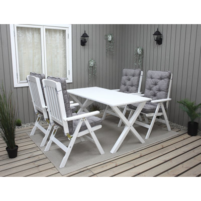 Hannahs 4 - Person Solid Wood Patio Dining Set Rectangular Table with Cushions Included