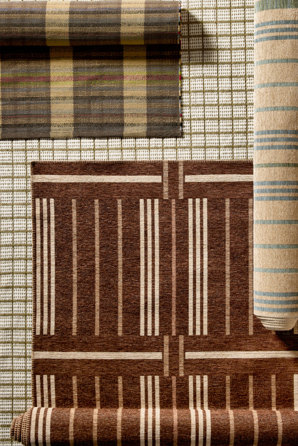 Overhead shot of four different area rug patterns.
