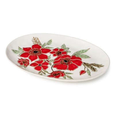 Festive Blooms Oval Platter 16x11 - Une vaste scène en grès blanc de 16 x 11 pouces bordée de fleurs écarlates audacieuses et de plantes botaniques des Fêtes, conçue pour les plus grandes pièces maîtresse.