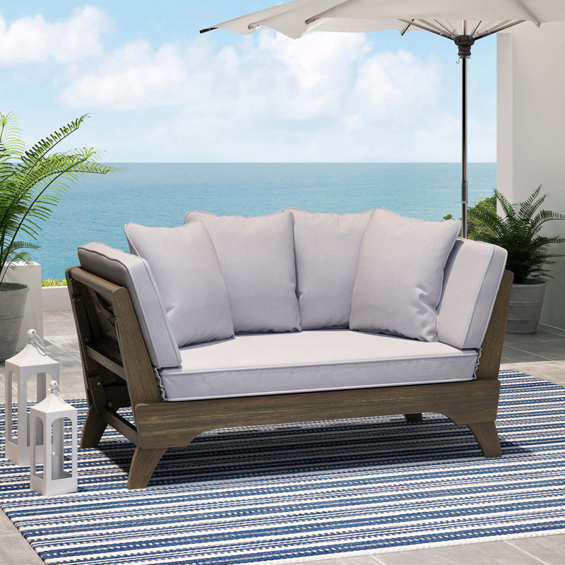 Lit de jour polyvalent et confortable en tissu, idéal pour la détente en plein air, se transformant parfaitement d'un canapé à un lit avec une fabrication durable.