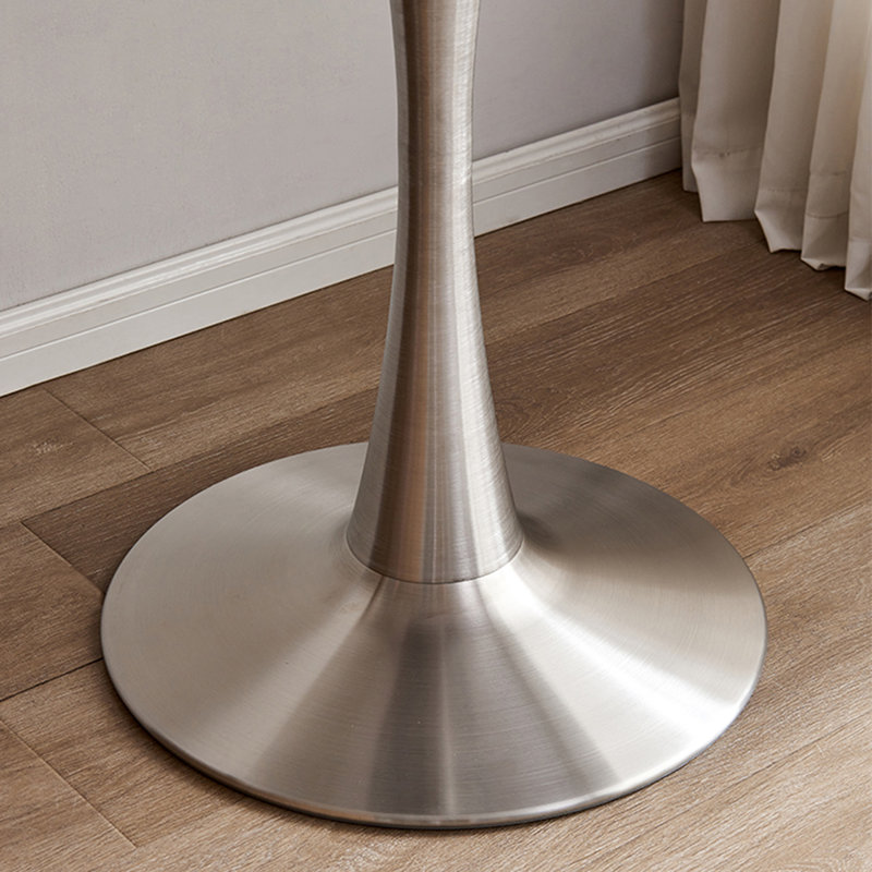 Table de salle à manger grise ronde en pierre frittée