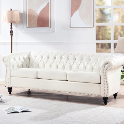 82.49" 3 Seater Rolled Arm , White Pu Upholstery, Staggered Deep Pull Buckles, Balanced Stress, Birch Legs With Paint Seal Finish Length, Leather, Foam Cushions, Wood + Plywood Inner Frame, Strong