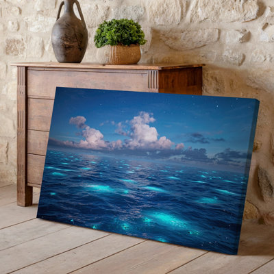Canvas A Serene Night Seascape Featuring A Vast Ocean Under A Wall Art Deep Blue Sky Illuminated By Ethereal Clouds That Shimmer With Canvas Wall Art