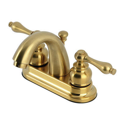 Kingston Brass Restoration Two-Handle 3-Hole Deck Mount 4" Centerset Bathroom Faucet with Plastic Pop-Up