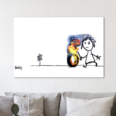Burning Tire II by Banksy Banksy - Wrapped Canvas Print