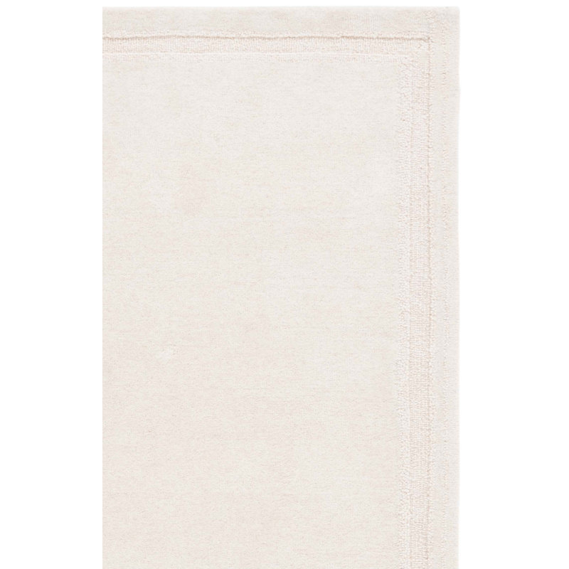 Sopheia Hand Tufted Wool Cotton Solid Color Rug in Ivory, Rectangle 5' x 8'