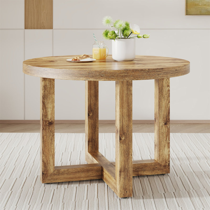 Une table de salle à manger circulaire moderne et pratique. Fabriqué en bois aggloméré et en bois.