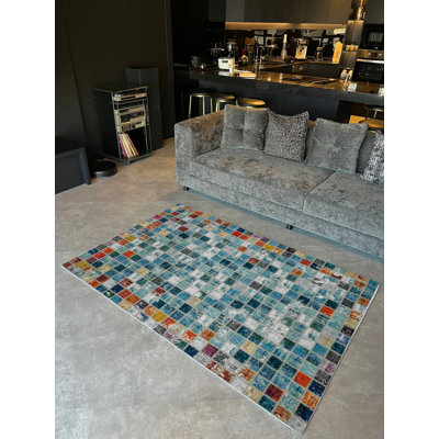 Tapis bleu tissé à motif mosaïque
