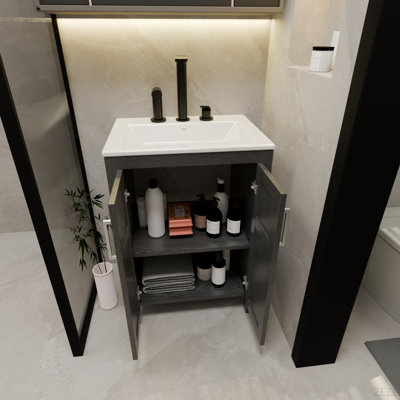 Cette armoire de salle de bain noire de 24 pouces, jumelée à un lavabo en céramique blanche, présente un design moderne et est fabriquée à partir de matériaux imperméables et durables.