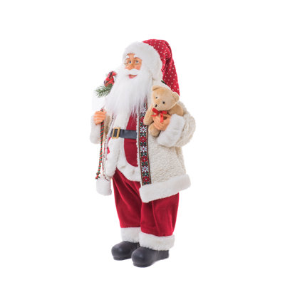 Tissu blanc / rouge debout avec un père Noël souriant tenant un ours en peluche