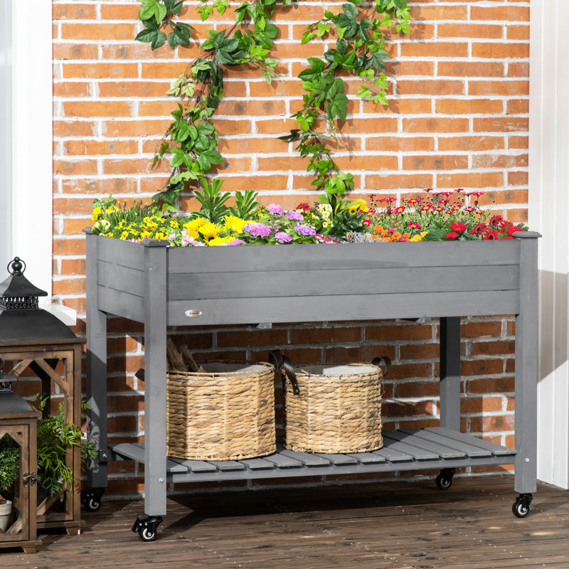 Lit de jardin surélevé Outsunny, jardinière en bois surélevée avec roues verrouillables, tablette de rangement et doublure de lit pour la cour arrière, le patio