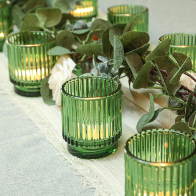 Ensemble de 12 porte-bougies vintage en verre nervuré vert