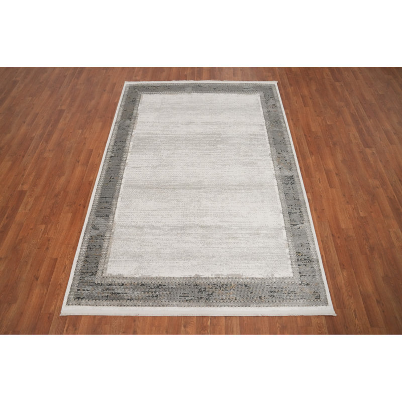 Tapis minimaliste 5 x 7 pour espaces modernes dans des tons ivoire et gris doux