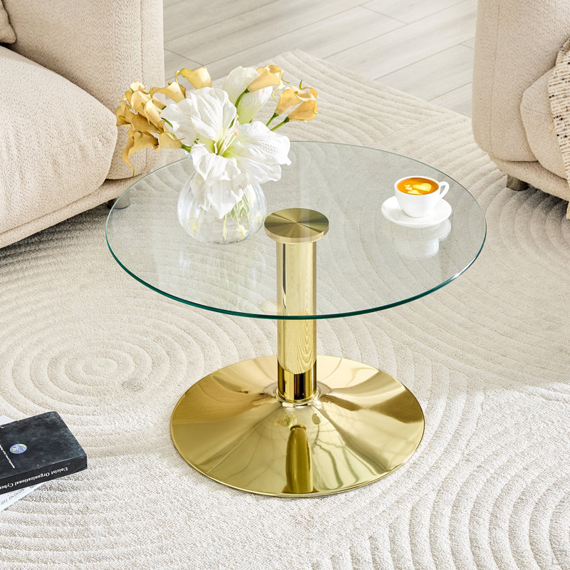 Table basse ronde en verre trempé. 17,7 pouces de haut, soutenu par une base en métal doré, avec un bord de luxe léger., Doré