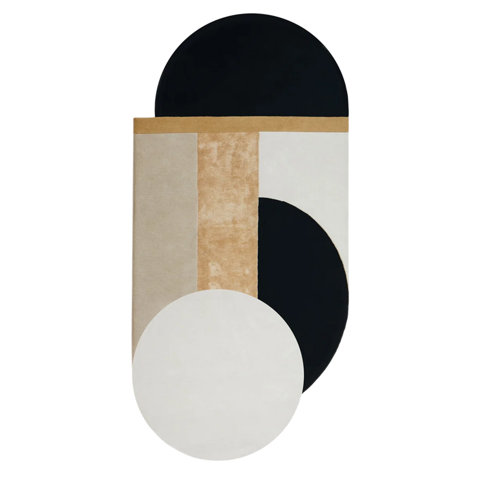 Abstract rug with geometric shapes in black, tan, and white.