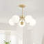 Lustre 5 têtes à finition dorée