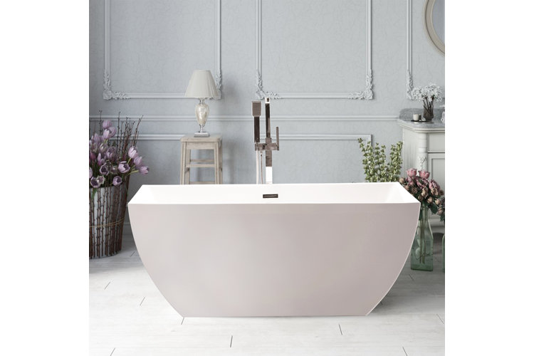 Rectangular-shaped freestanding acrylic bathtub in a room with lots of flower arrangements and pale blue wainscoted walls.