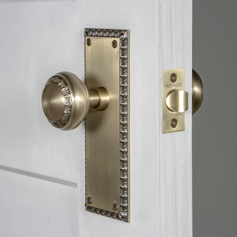 Nostalgic Warehouse Neoclassical Plate Privacy (Bed & Bath) with Neoclassical Knob, Antique Brass, 2.75"