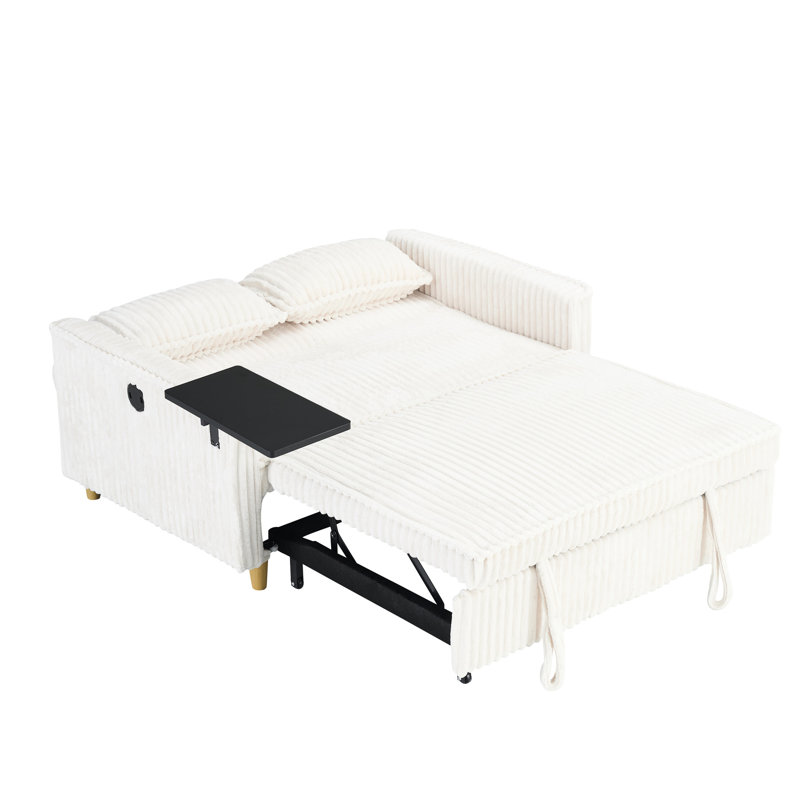 Velours côtelé beige confortable avec bureau mobile et écran, idéal pour les espaces de détente et de travail, créant un environnement de vie confortable