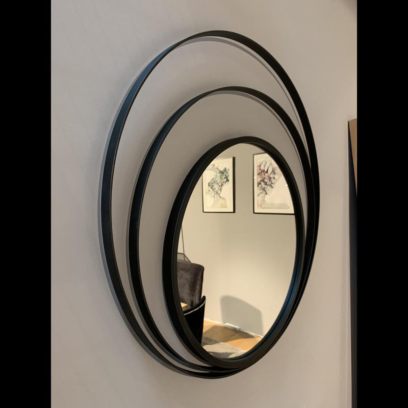 Baudilio Round Metal Framed Wall Mounted Accent Mirror in Black