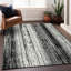 Tapis intérieur / extérieur en polyester tissé à la machine noir / beige Charysse-109576456