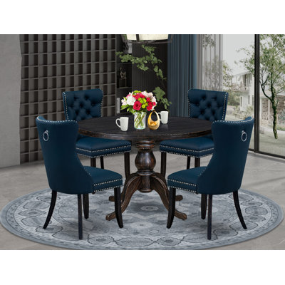 L'ensemble de table de salle à manger 5 pièces comprend une table ronde de 48 po avec piédestal et 4 chaises rembourrées en tissu de polyester bleu marine, noir sablé