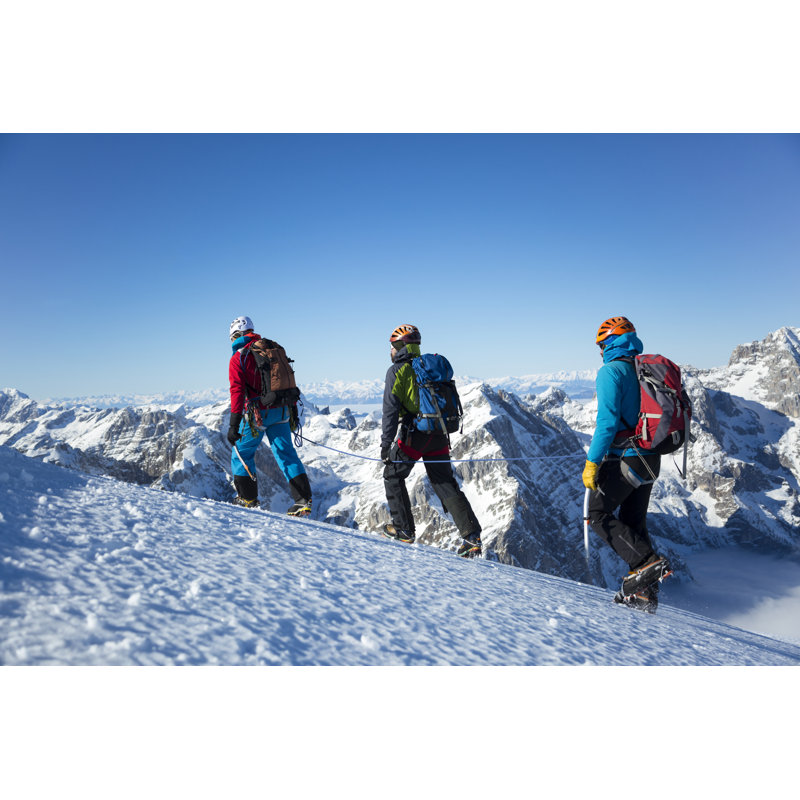 Men Hiking On Snow by Simonkr - No Frame Print on Canvas, 61cm H x 91cm W