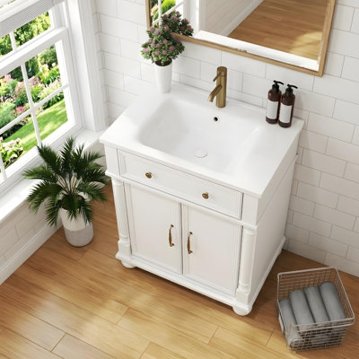 Meuble-lavabo 28 po avec lavabo en céramique, portes à fermeture douce et tablettes réglables
