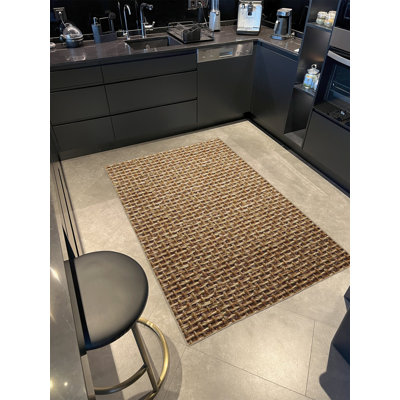 Base tissée et tapis lavable avec motifs à nœuds dans des tons d'osier
