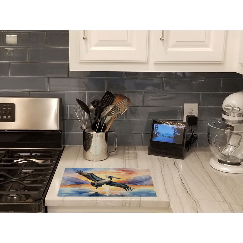 Pelican Fyling at Sunrise Glass Cutting Board