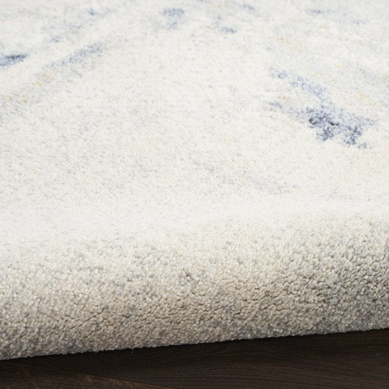 Tapis d'intérieur moderne bleu ivoire Wrought Studio ™ Motion 5 pi 3 po x 7 pi