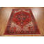 Tapis traditionnel rouge en laine à médaillon 7 x 11