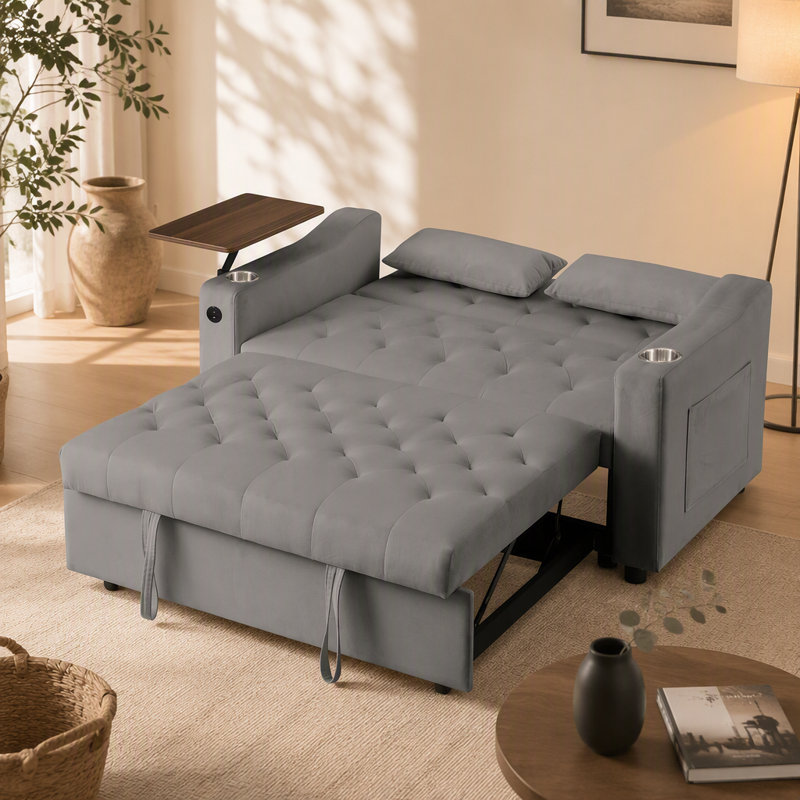 Canapé-lit en velours gris avec table d'appoint, porte-gobelet et port USB pour un confort et une commodité modernes.