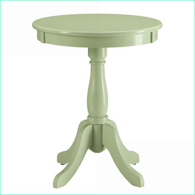 Table basse de style chalet vert clair avec piédestal tourné, peu encombrante pour les petits espaces de vie