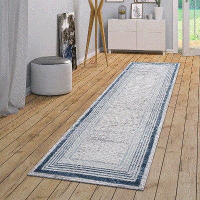 Tapis bleu / ivoire / bordé de la collection Loom & Luxe