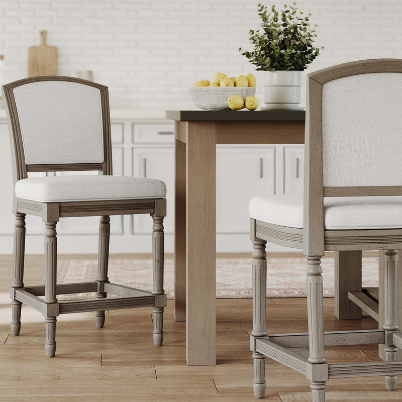 Tabouret de bar gris patiné avec assise et dossier rembourrés gris