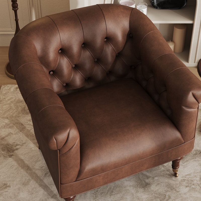 Fauteuil club en cuir avec dossier et roulettes capitonnés