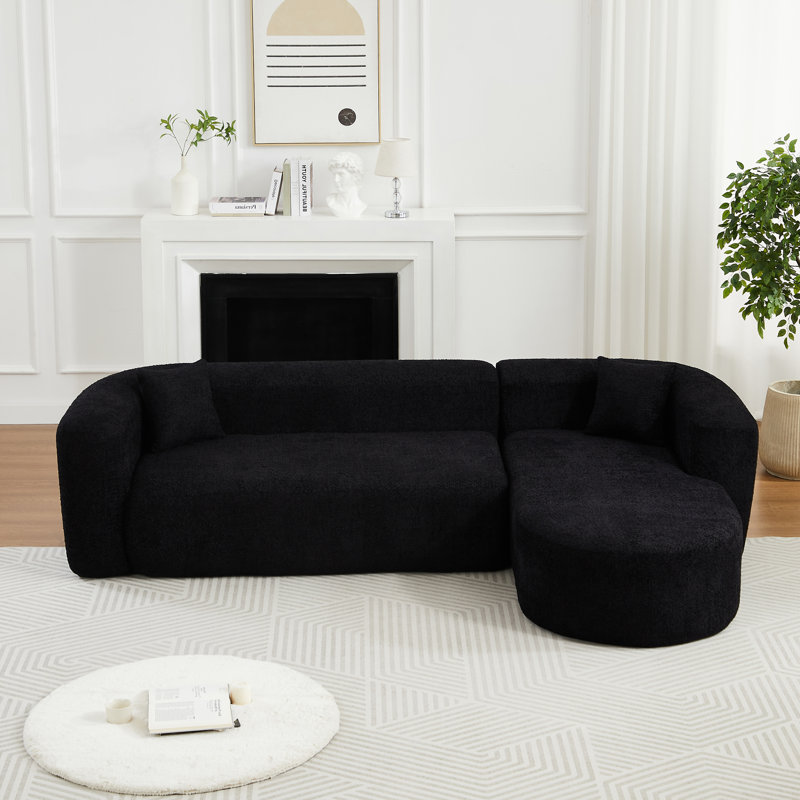 Canapé modulaire modulaire en L avec dossier incurvé, tissu chenille et confort moelleux pour les espaces de vie modernes.