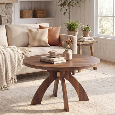 Table basse ronde moderne en bois avec pieds croisés courbés