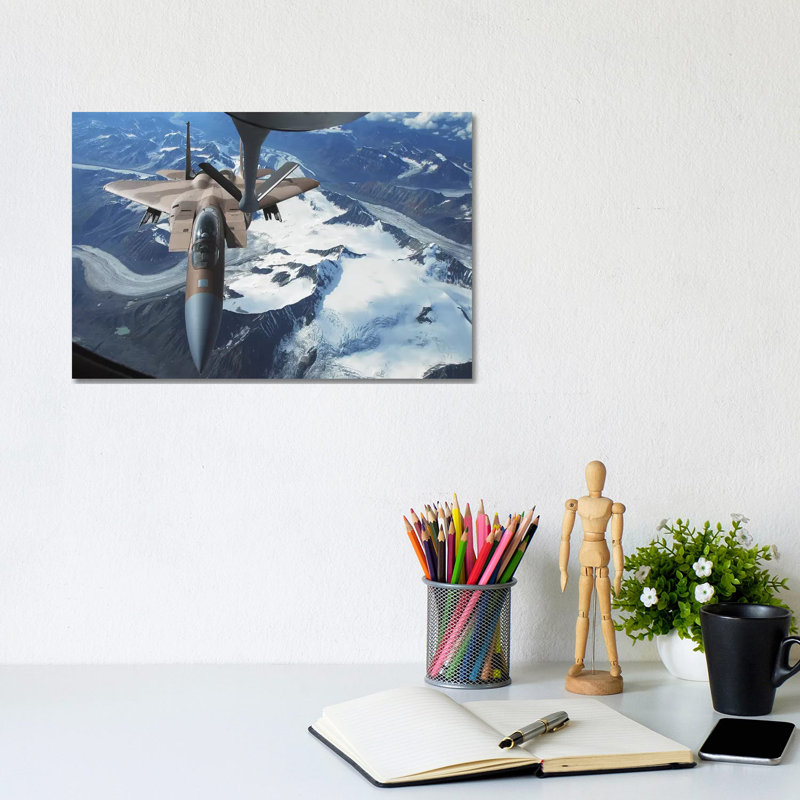 An F-15C Eagle Aircraft Sits Behind A KC-135R Stratotanker by Stocktrek Images - Wrapped Canvas Print