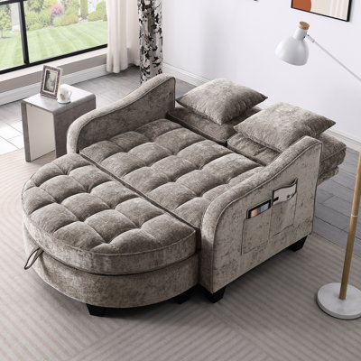 Chaise longue double en brun, avec un design irrégulier, une assise confortable et un repose-pieds caché en velours côtelé brun à deux places avec coussins incurvés,