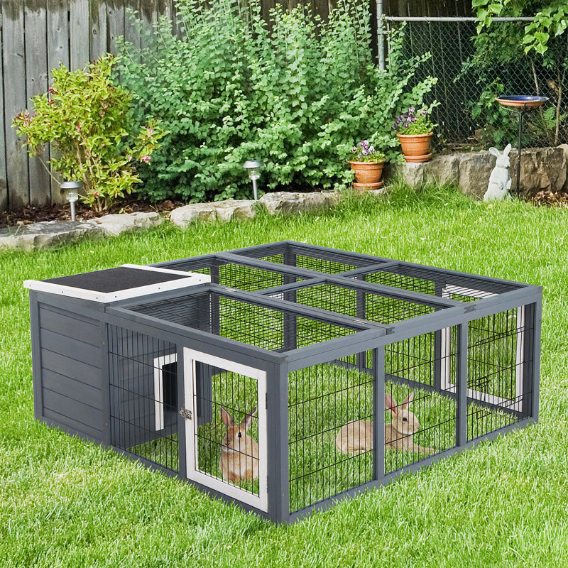 Cage à lapin soigneusement conçue pour les petits animaux de compagnie, assurant confort et jeu, Gris