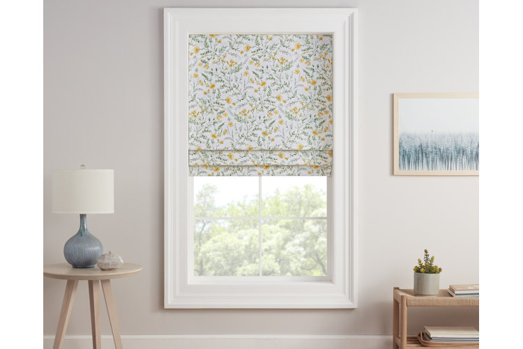 White floral blinds on a living room window. Side table and small console table on either side of the window