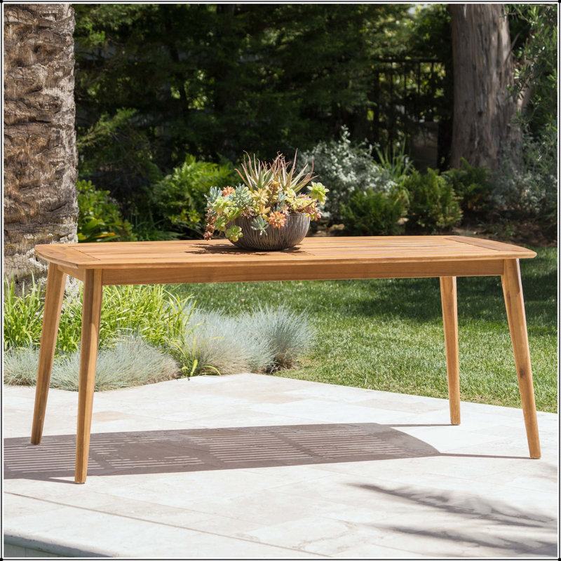 Table de salle à manger d'extérieur en bois d'acacia avec structure courbée et finition en teck