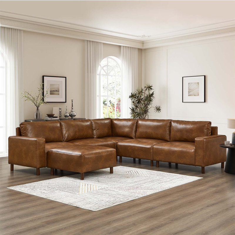 Canapé modulaire de luxe moderne avec une conception modulaire, un cuir PU respirant et une structure en bois massif pour un confort ultime