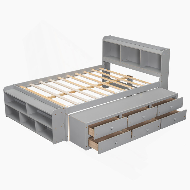 Lit pratique avec bibliothèque latérale multifonctionnelle et tiroirs à roulettes lisses pour une chambre bien rangée et relaxante