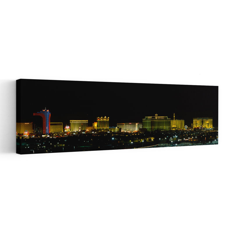 Buildings Lit Up At Night In A City Las Vegas Nevada USA by Jack Krawczyk - Wrapped Canvas Panoramic Print