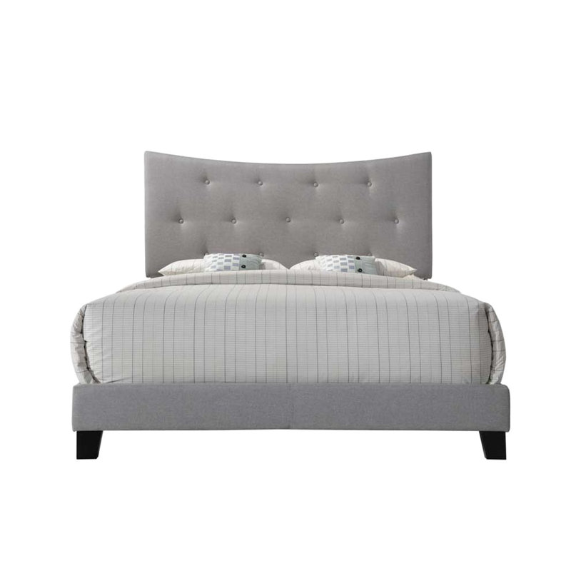 Lit en tissu gris avec tête de lit arquée et pieds noirs modernes