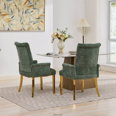 Chaise de salle à manger rembourrée avec accoudoirs, dossier haut capitonné, garniture cloutée et pieds en acier inoxydable, verte