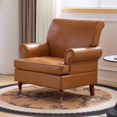 Fauteuil club rétro en cuir synthétique avec passepoil contrastant et coussin en T pour le salon